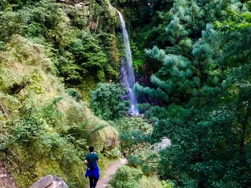 Natural water shower under Chhoi Waterfall near Jibhi